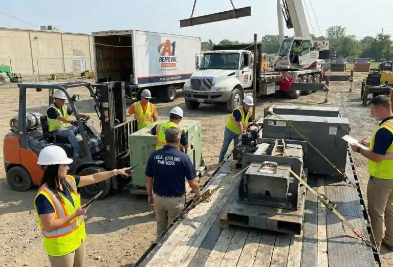 A1 Waste Removal team overseeing a forklift and truck loading operation during professional execution.