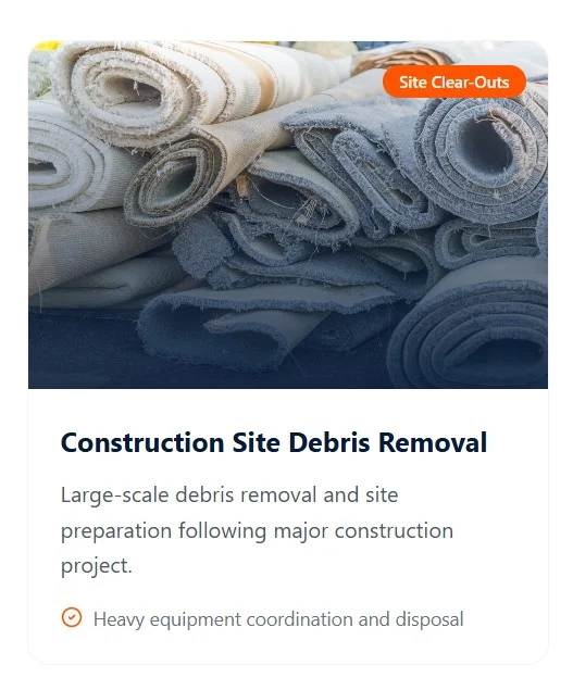 Stacked carpet rolls and construction waste ready for professional hauling and disposal