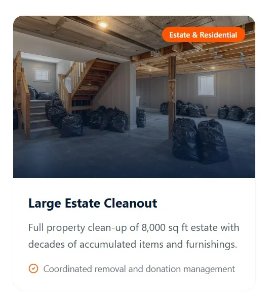 A cleared residential basement with organized debris bags during an estate cleanout